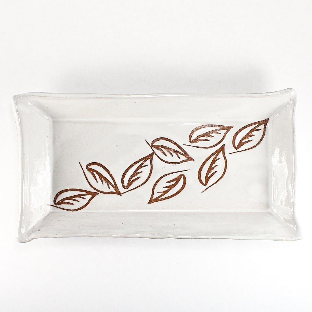 White ceramic tray with leaf stencils - top view